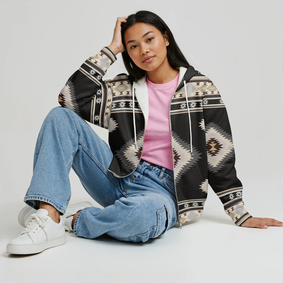 A woman wearing a Authentic Pattern Southwestern Tribal Fleece Jacket – Warm & Stylish
