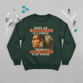 Green sweatshirt with Native American artwork, representing pride, unity, and strength.