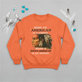 Orange sweatshirt with bold Native American design, symbolizing strength and empowerment.