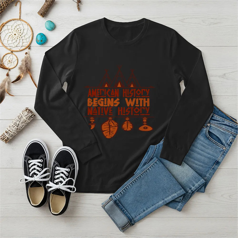Black long sleeve tee featuring brown teepee and feather totem graphic with quote “American History Begins with Native History