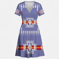 Blue V-neck dress with a prominent eagle/thunderbird motif and geometric patterns