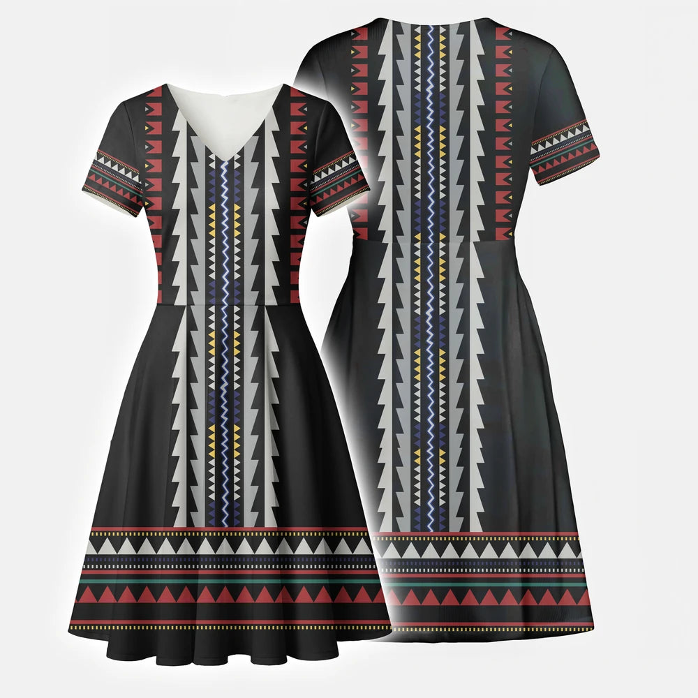 Model in a flowy black geometric dress and skirt set with tribal Southwest print, styled for a casual boho festival look.