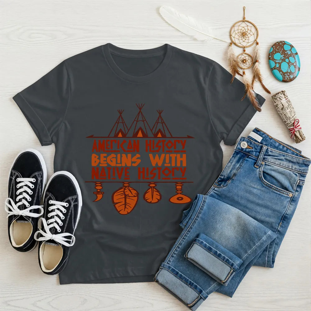 Charcoal gray t-shirt displaying brown teepee and feather totem graphic with quote “American History Begins with Native History.