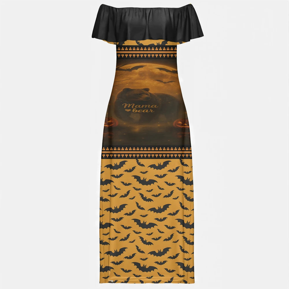 Full-length image of a woman wearing a black and orange off-shoulder maxi dress with a "Mama Bear" graphic featuring a bear silhouette, moon, bats, and pumpkins on the top half, and an all-over black bat pattern on an orange background on the bottom half.