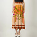 Maxi skirt with warm rainbow arcs, leaves, and blooming flowers