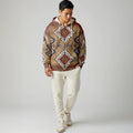 Front view of a male model in an earth-tone geometric Native-inspired blanket hoodie with intricate patterns and soft fleece lining