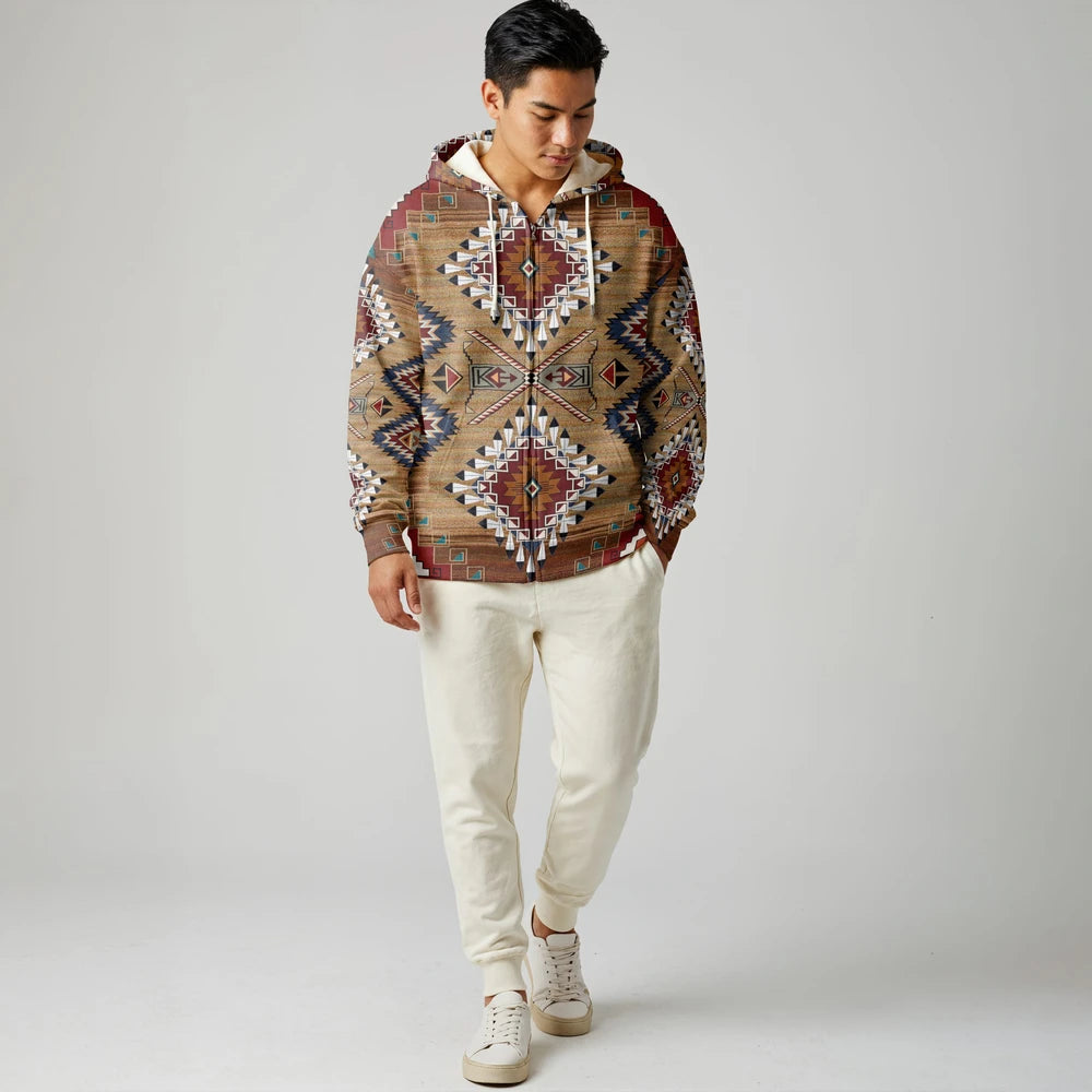 Front view of a male model in an earth-tone geometric Native-inspired blanket hoodie with intricate patterns and soft fleece lining