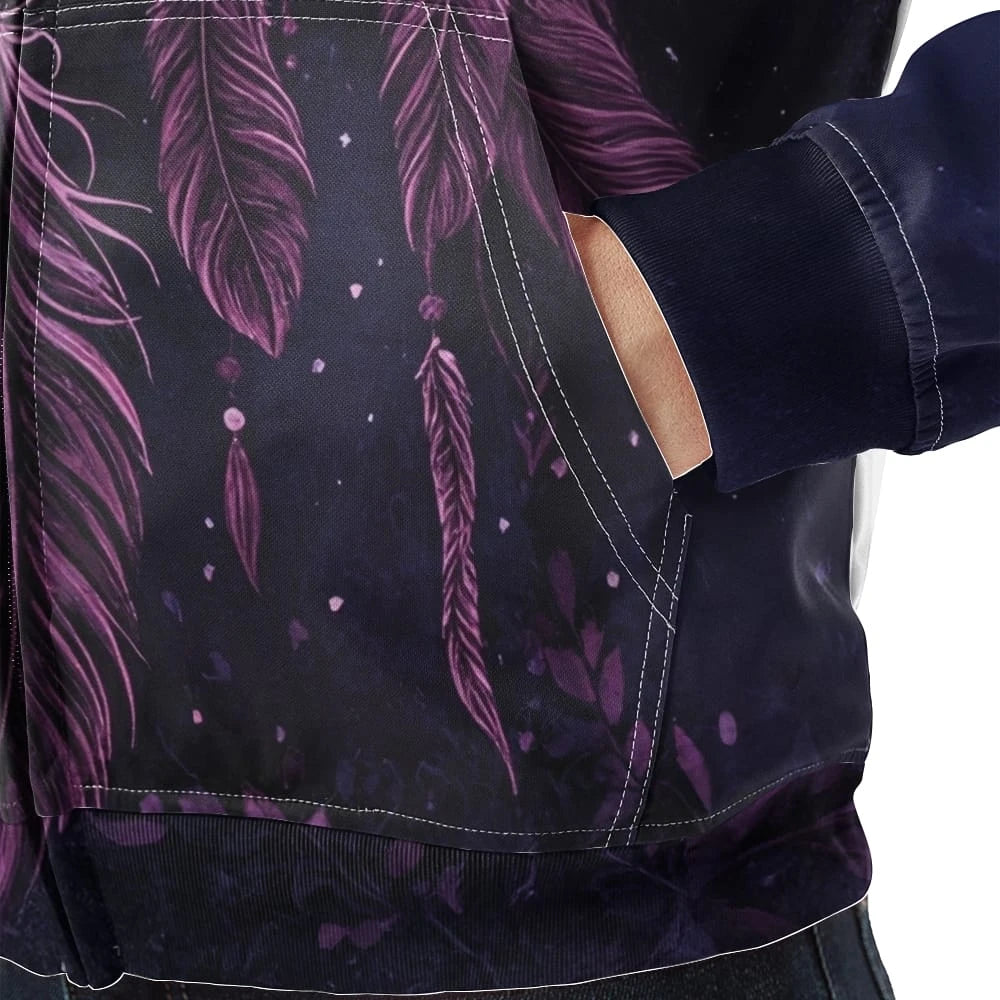 Close-up of the kangaroo pocket area on the fleece jacket, displaying purple dreamcatcher feathers and subtle forest floor foliage printed on deep indigo fabric.
