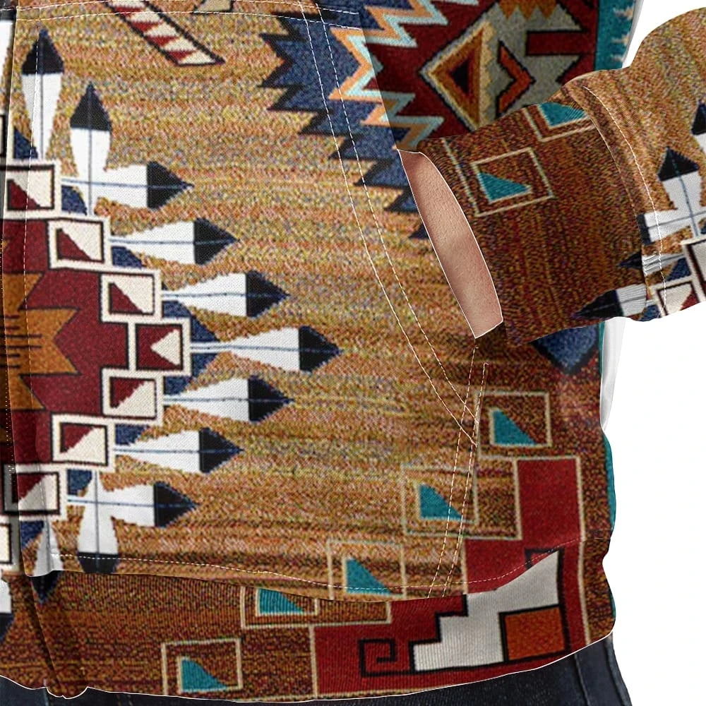 Close-up view of the jacket’s pocket showing detailed stitching and vivid tribal patterns with red, white, black, and teal accents.