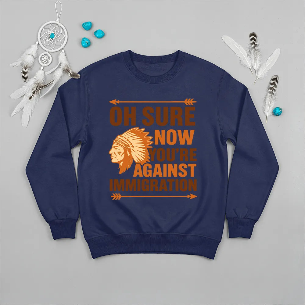 Native America graphic navy sweatshirt with traditional chief headgear and 'Oh Sure Now You’re Against Immigration' text