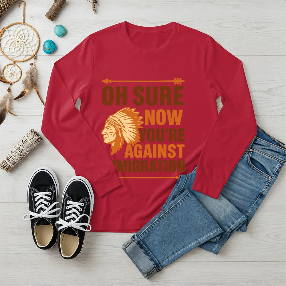 "Native American long sleeve tee with chief headdress and immigration statement."