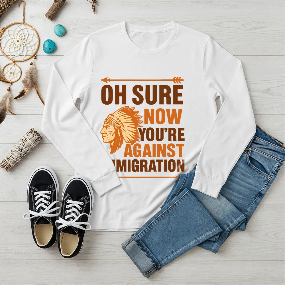 "Native American long sleeve tee with chief headdress and immigration slogan."