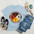 Light blue Native America t-shirt featuring Missing & Murdered Indigenous Women graphic with colorful handprints.