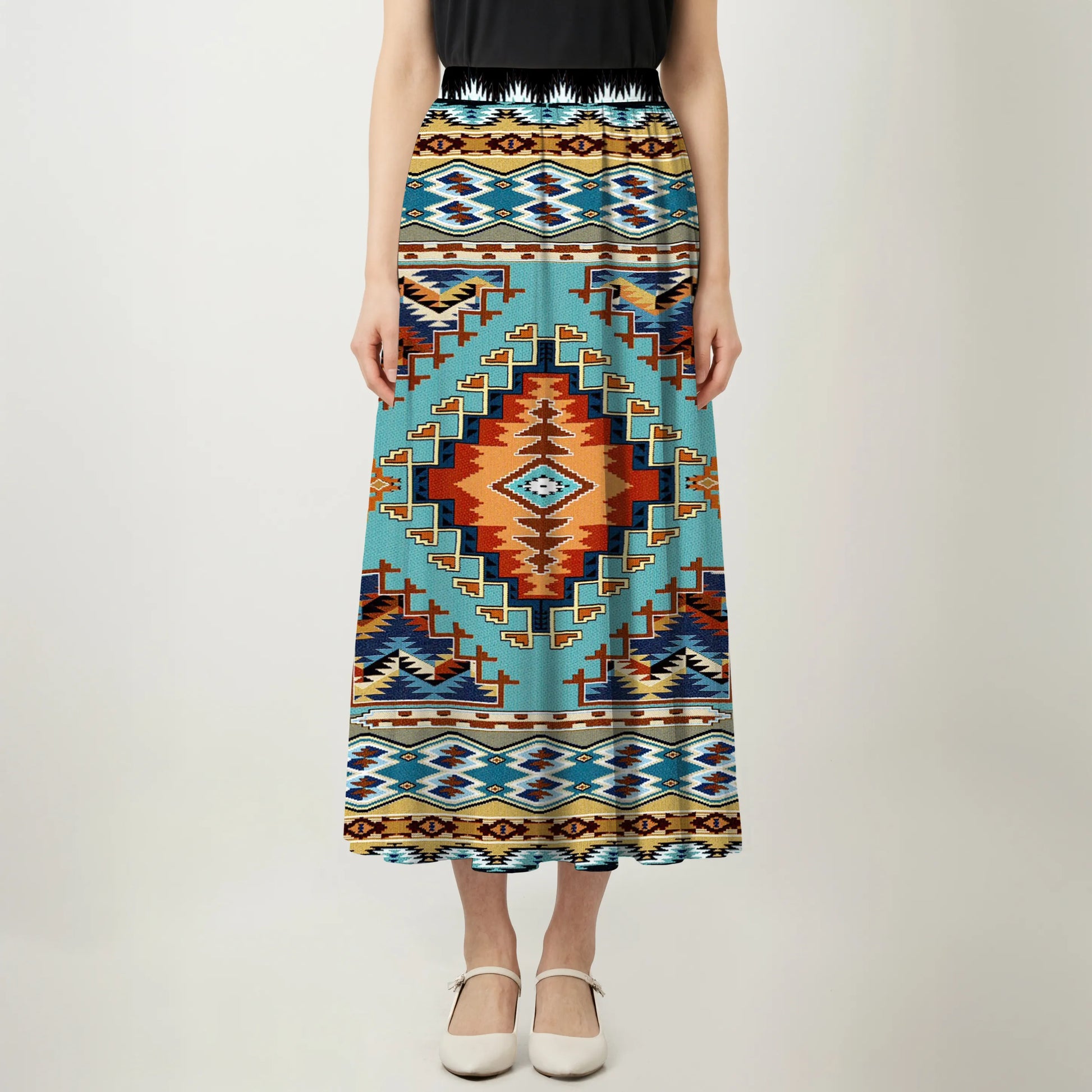 Front view of an asymmetrical maxi skirt with Native American Southwest Navajo-inspired geometric tribal patterns and a teal and black waistband.