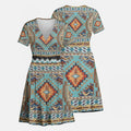 Front and back view of a Native American Southwest Navajo-inspired V-neck mini dress with intricate geometric tribal patterns in earthy tones.