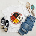 White Native America t-shirt featuring a bold MMIW design with colorful handprints.