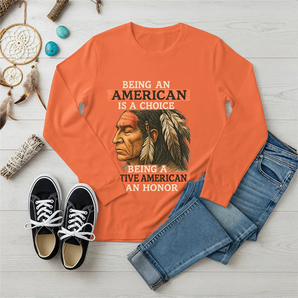Orange long sleeve T-shirt with Native American quote and artwork, representing the strength and honor of indigenous culture.