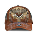 Brown baseball cap with detailed Native American dreamcatcher and eagle design on the front.