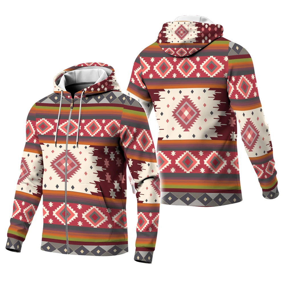 Male model wearing a rust and ivory diamond-patterned Native-American–inspired hoodie, arms relaxed, standing against a simple studio wall