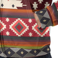 Close-up of jacket’s kangaroo pocket area, showing red, cream, and gray tribal diamond pattern and visible stitching on soft fleece fabric.