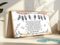 Close-up of Native American Prayer artwork featuring feathers and text
