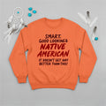 Orange sweatshirt with a Native American quote and tribal artwork, symbolizing empowerment and pride.