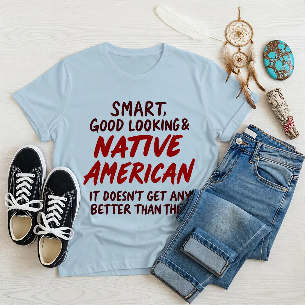 Blue T-shirt featuring a Native American-inspired quote and tribal artwork, celebrating pride and heritage.