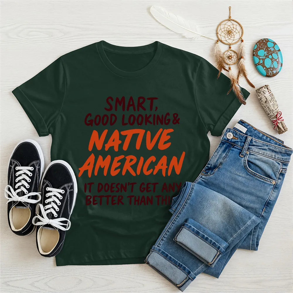 Green T-shirt with bold Native American quote and tribal design, representing pride and strength.