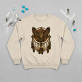 Beige sweatshirt featuring an owl and dreamcatcher design, embodying peace and cultural heritage.