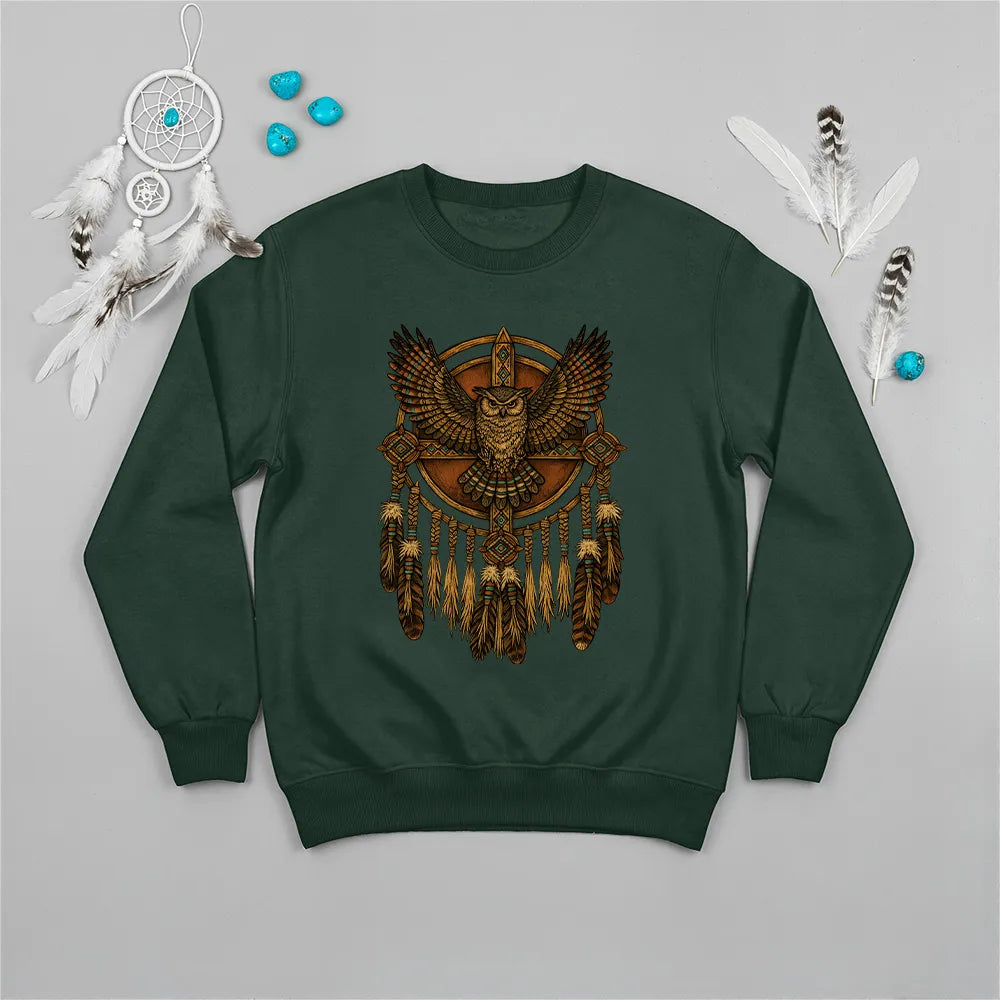Green sweatshirt with an owl and dreamcatcher design, representing strength and guidance from Native traditions.