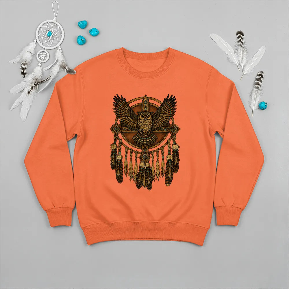 Orange sweatshirt featuring a Native American-inspired owl and dreamcatcher design, symbolizing guidance and protection.