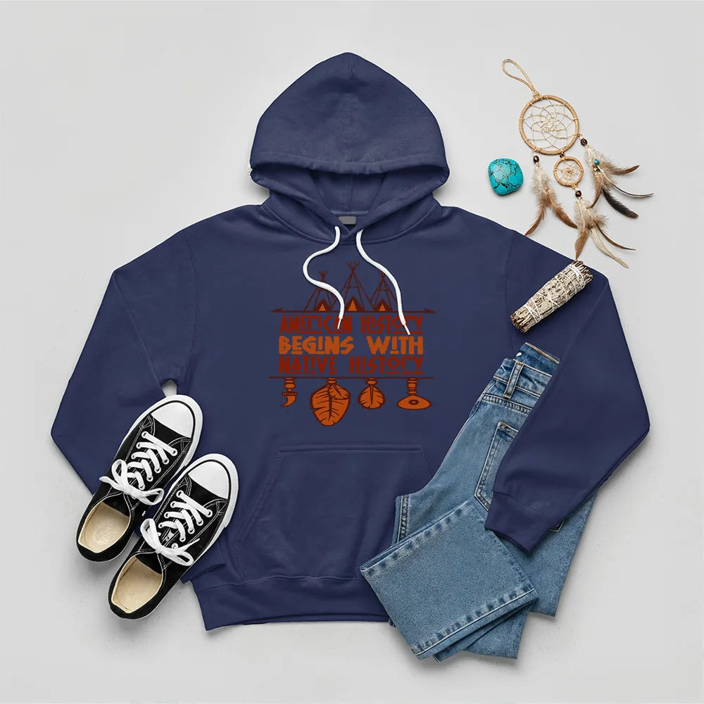 Light blue hoodie featuring brown teepee and feather totem graphic with quote “American History Begins with Native History