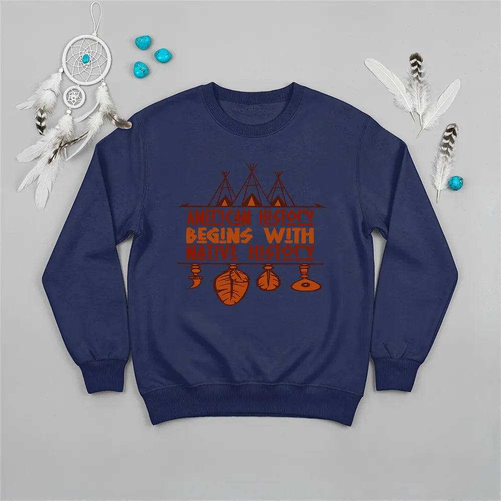 Light blue crewneck sweatshirt featuring a sacred teepee and feather totem design with the quote “American History Begins with Native History.