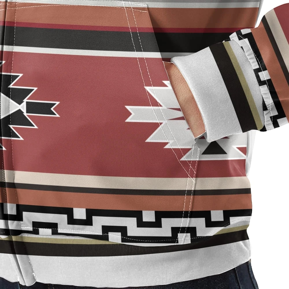 Detailed close-up of the kangaroo pocket area showing the terracotta and cream tribal motifs and geometric black-and-white trim against the fleece fabric.