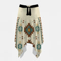 Cream asymmetrical skirt with Southwestern tribal geometric pattern in brown, teal, and gold, and a black tie waist.