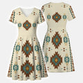 Cream short-sleeve V-neck wrap mini dress with Southwestern tribal geometric pattern in brown, teal, and gold.
