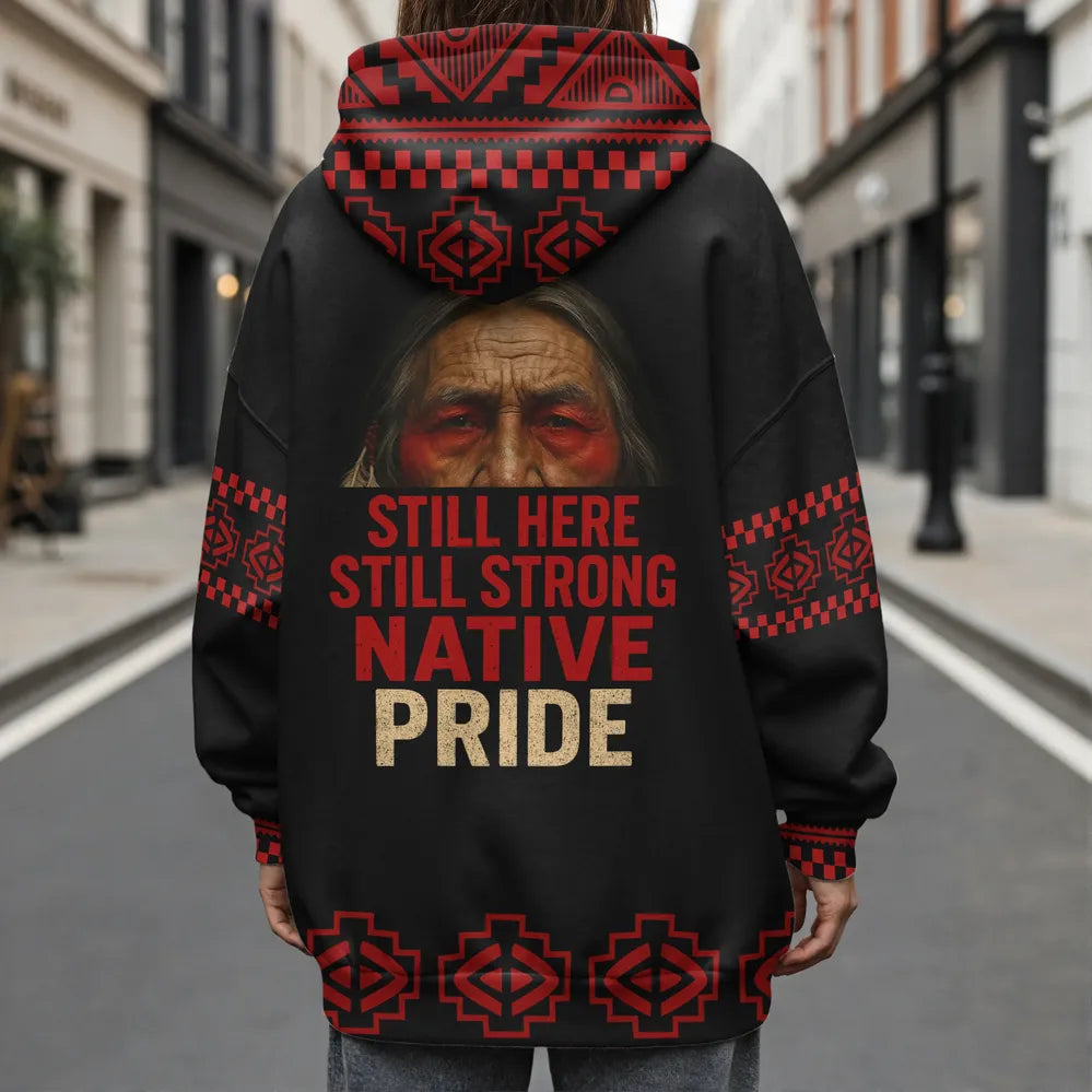 
Person wearing Native Pride jacket in urban street, featuring strong cultural message
