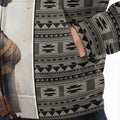 Close-up of hoodie pocket area highlighting geometric tribal print and fabric texture
