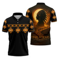 Black polo shirt with orange Native American geometric patterns across chest and sleeves; back features a glowing moon, tribal‑chief headdress silhouette, silhouettes of walkers on a winding path, and the text “Trail of Tears – Never Forgotten.”