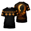 Black crew‑neck t‑shirt with orange geometric pattern band across the chest and sleeves; back shows a profile of a tribal chief under a full moon and small figures walking, with “Trail of Tears – Never Forgotten” below.