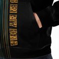 Close-up of golden tribal pattern printed near jacket pocket