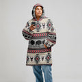 Model in a grey snug-up hoodie printed with red and black diamond tribal patterns, hood up and hands tucked in pouch pocket, photographed on white background