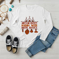 White long sleeve tee featuring brown teepee and feather totem graphic with quote “American History Begins with Native History