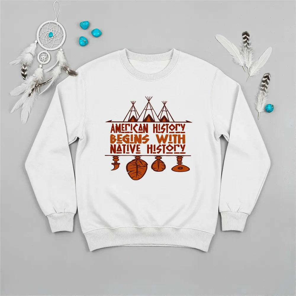 White crewneck sweatshirt featuring a sacred teepee and feather totem design with the quote “American History Begins with Native History.