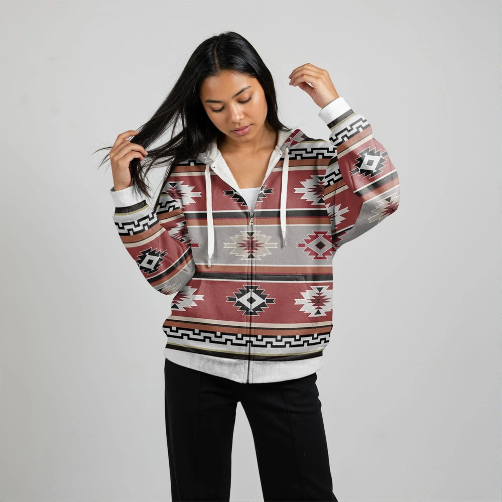 Side view of a female model in a rust and teal diamond-patterned wearable blanket hoodie, showcasing drape and kangaroo pocket detail.