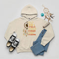 A desert sand hoodie featuring ‘Listen to the Wind’ dreamcatcher print inspired by Plains tribes.