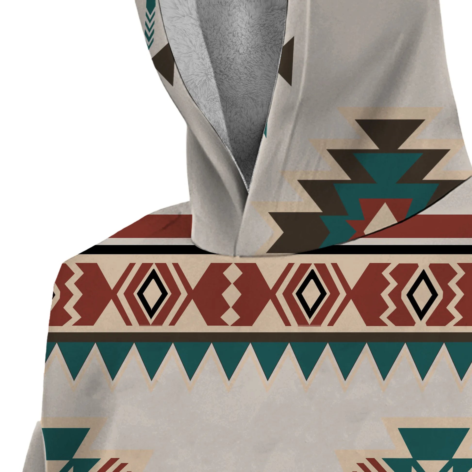 Close-up of the hoodie’s hood area showing detailed desert tribal motifs in rust and teal on a cream background, with shaggy inner lining visible at the opening.
