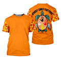 Orange short‑sleeve t‑shirt featuring repeated red yellow black and white handprints on sleeves and a large turtle handprint motif with “Every Child Matters” on the back.
