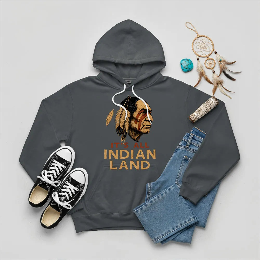 A dark grey hoodie showcasing the "It’s All Indian Land" slogan and Native American headdress design