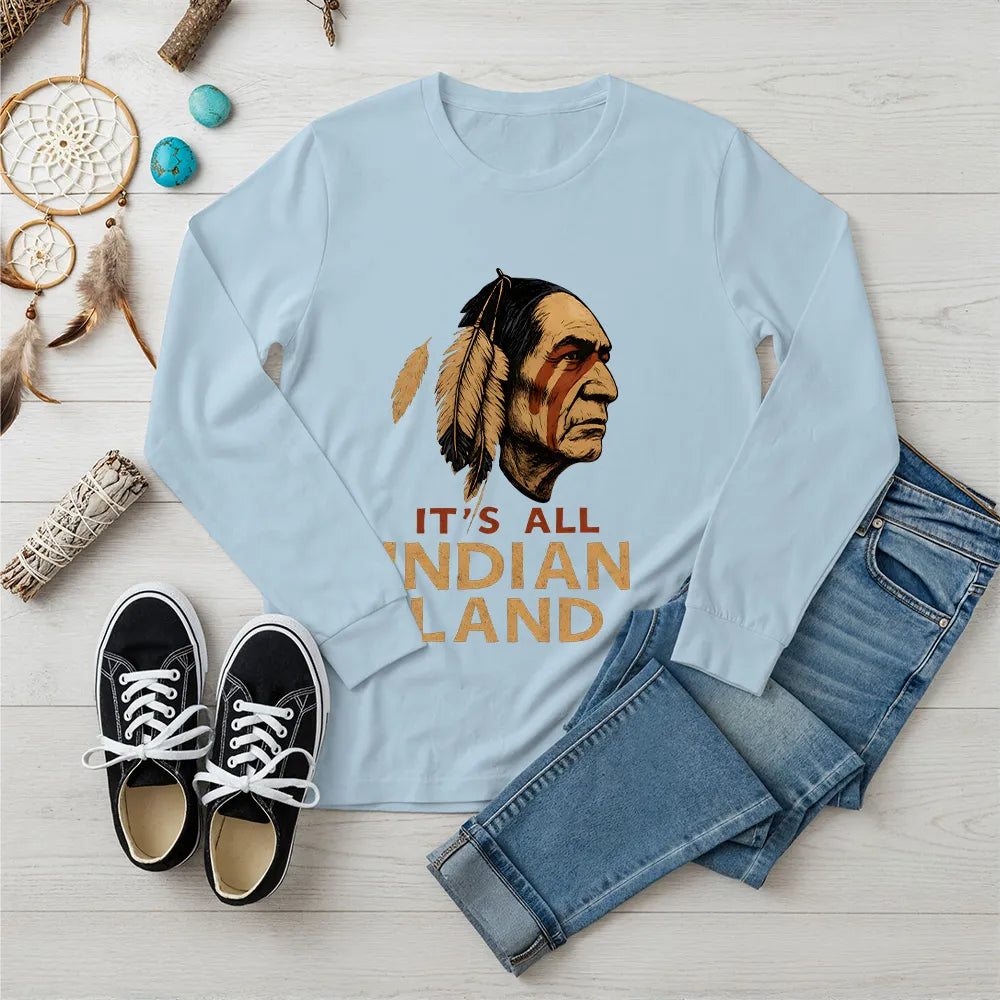 A light blue long sleeve t-shirt with the "It’s All Indian Land" message and Native American headdress illustration.